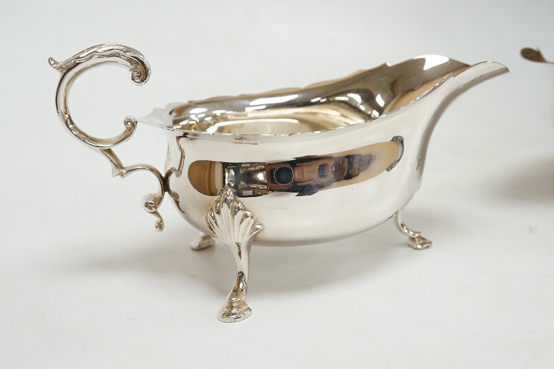 A pair of modern silver sauceboats, with flying scroll handles, C.J. Vander Ltd, Sheffield, 1989, length 14.9cm, 9.5oz.